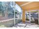 Screened porch with brick flooring, overlooking backyard at 2529 Clareside Dr, Valrico, FL 33596