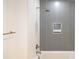 Spa-like bathroom with gray tile shower and gold fixtures at 777 3Rd N Ave # 1605, St Petersburg, FL 33701