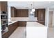 Modern kitchen with dark wood cabinets and quartz countertops at 777 3Rd N Ave # 1605, St Petersburg, FL 33701