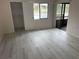 Spacious bedroom with water view, new flooring, and walk-in closet at 208 Nina Way # 208, Oldsmar, FL 34677