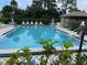 Community swimming pool with ample deck space at 208 Nina Way # 208, Oldsmar, FL 34677
