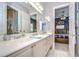 Bathroom with double vanity and view of bedroom at 20953 Broadwater Dr, Land O Lakes, FL 34638