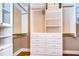 Large walk-in closet with ample shelving and drawers at 20953 Broadwater Dr, Land O Lakes, FL 34638