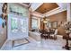 Elegant dining room features a chandelier, large windows, and a decorative wall at 20953 Broadwater Dr, Land O Lakes, FL 34638