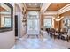 Elegant dining room features a chandelier, large windows, and a decorative wall at 20953 Broadwater Dr, Land O Lakes, FL 34638
