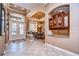 Spacious entryway with tile flooring, double doors, and built-in cabinetry at 20953 Broadwater Dr, Land O Lakes, FL 34638