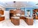 Modern kitchen with granite countertops, stainless steel appliances, and blue walls at 20953 Broadwater Dr, Land O Lakes, FL 34638