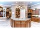 Large kitchen island with granite countertops and ample wooden cabinetry at 20953 Broadwater Dr, Land O Lakes, FL 34638