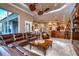 Open living room and kitchen with hardwood floors and island at 20953 Broadwater Dr, Land O Lakes, FL 34638