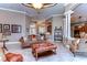 Spacious living room featuring a large leather sectional sofa and a beautiful area rug at 20953 Broadwater Dr, Land O Lakes, FL 34638