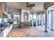 Outdoor kitchen features stainless steel appliances, fireplace, and paver patio at 20953 Broadwater Dr, Land O Lakes, FL 34638