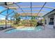 Screened-in pool and spa with paver deck at 20953 Broadwater Dr, Land O Lakes, FL 34638