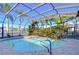 Screened-in pool and spa with paver deck at 20953 Broadwater Dr, Land O Lakes, FL 34638