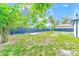 Newly built home with fenced backyard and grassy area at 4008 W Leila Ave, Tampa, FL 33616