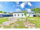 Newly built home with a fenced backyard and grassy area at 4008 W Leila Ave, Tampa, FL 33616