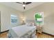 Charming bedroom featuring a queen-size bed and a ceiling fan at 4008 W Leila Ave, Tampa, FL 33616