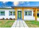 Updated home exterior with modern design and landscaping at 4008 W Leila Ave, Tampa, FL 33616