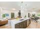 Modern kitchen with large marble island and stainless steel appliances at 4008 W Leila Ave, Tampa, FL 33616