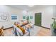 Modern living room with leather couch and wood coffee table at 4008 W Leila Ave, Tampa, FL 33616