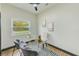 Bright home office with glass desk and comfortable chairs at 4008 W Leila Ave, Tampa, FL 33616