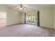 Spacious main bedroom with sliding glass doors leading to the patio at 7853 Sundown Dr, St Petersburg, FL 33709