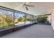 Screened patio overlooks a refreshing pool and lush landscape at 7853 Sundown Dr, St Petersburg, FL 33709