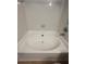 Clean and spacious bathtub with neutral tile surround at 10024 Strafford Oak Ct # 815, Tampa, FL 33624