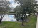 Scenic view of a pond and lush green landscape from a condo at 10024 Strafford Oak Ct # 815, Tampa, FL 33624