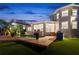 Luxury home with pool and patio at dusk at 123 8Th E St, Tierra Verde, FL 33715