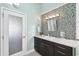 Bathroom with mosaic tile and frosted glass door at 123 8Th E St, Tierra Verde, FL 33715