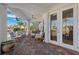 Covered patio with comfortable seating and access to the outdoors at 123 8Th E St, Tierra Verde, FL 33715