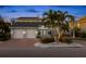 Stunning two-story home with a brick facade and palm trees at 123 8Th E St, Tierra Verde, FL 33715