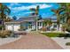 Modern home with two-car garage and landscaped yard at 123 8Th E St, Tierra Verde, FL 33715