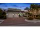 Stunning two-story home with a brick facade and palm trees at 123 8Th E St, Tierra Verde, FL 33715