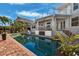 Inviting swimming pool with brick patio and lush landscaping at 123 8Th E St, Tierra Verde, FL 33715