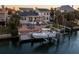 Boat lift and backyard at sunset, waterfront property at 123 8Th E St, Tierra Verde, FL 33715