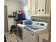 Laundry room with washer, dryer, and storage at 12961 Sophia Cir, Largo, FL 33774