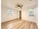 Bright bedroom with light wood floors and ceiling fan at 6602 N 11Th St, Tampa, FL 33604