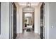 Bright entryway with tile flooring and views into the living areas at 15304 Serengeti Blvd, Spring Hill, FL 34610