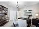 Spacious home office with built-in shelving and desk at 15304 Serengeti Blvd, Spring Hill, FL 34610