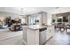 Open concept kitchen with granite island, stainless steel appliances, and breakfast bar at 15304 Serengeti Blvd, Spring Hill, FL 34610