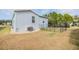 Home's backyard with a fenced-in area for pets at 3836 Chris Dr, Wesley Chapel, FL 33543