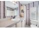 Clean bathroom with updated vanity and striped wallpaper at 3836 Chris Dr, Wesley Chapel, FL 33543
