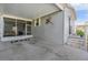 Covered carport with screened enclosure and storage at 3836 Chris Dr, Wesley Chapel, FL 33543