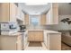 Cozy kitchen with white appliances and light wood cabinets at 3836 Chris Dr, Wesley Chapel, FL 33543