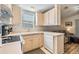 Efficient kitchen with white appliances and light wood cabinets at 3836 Chris Dr, Wesley Chapel, FL 33543