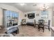 Bright living room with comfy seating, dining area, and sliding glass door at 3836 Chris Dr, Wesley Chapel, FL 33543