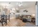 Open living room and kitchen with a cozy couch and dining area at 3836 Chris Dr, Wesley Chapel, FL 33543