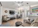Living room features a dining area, comfy seating and a view into the kitchen at 3836 Chris Dr, Wesley Chapel, FL 33543