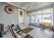 Screened porch with seating area and ceiling fan at 3836 Chris Dr, Wesley Chapel, FL 33543